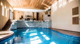 Custom Indoor Pool with Raised Stone Wall